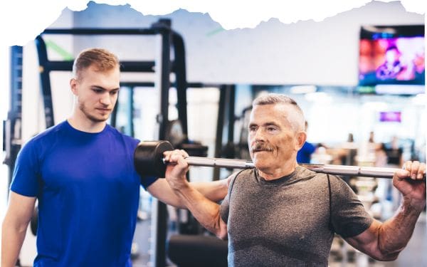 Getting started with weight training after 40. Man doing lunges with barbell